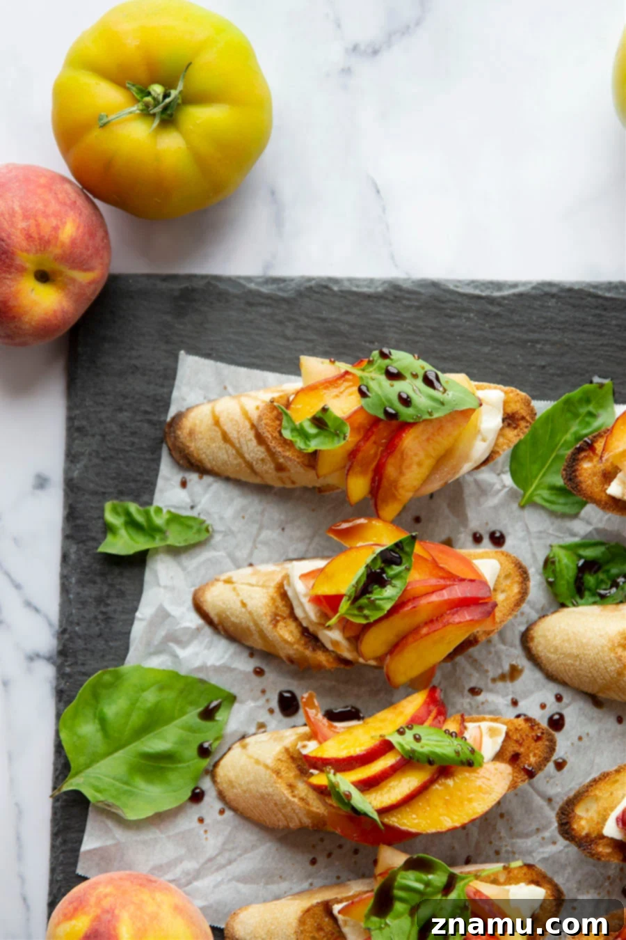 Golden Peach Caprese Toasts 3 Layers of juicy peaches, fresh mozzarella, vibrant heirloom tomatoes, and basil on toasted bread drizzled with balsamic glaze.