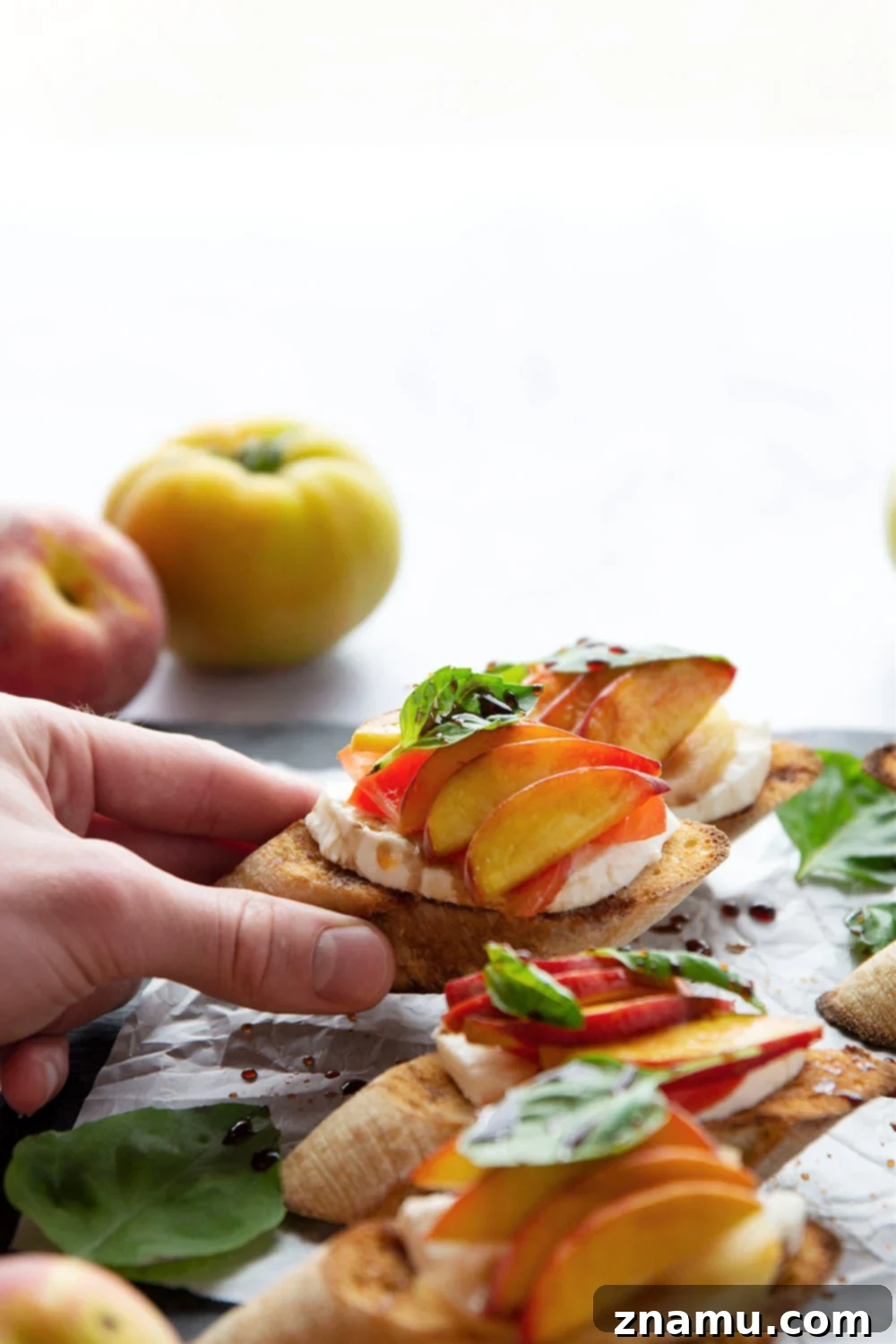 Golden Peach Caprese Toasts 5 Freshly assembled Caprese Peach Bruschetta with a light drizzle of balsamic glaze.