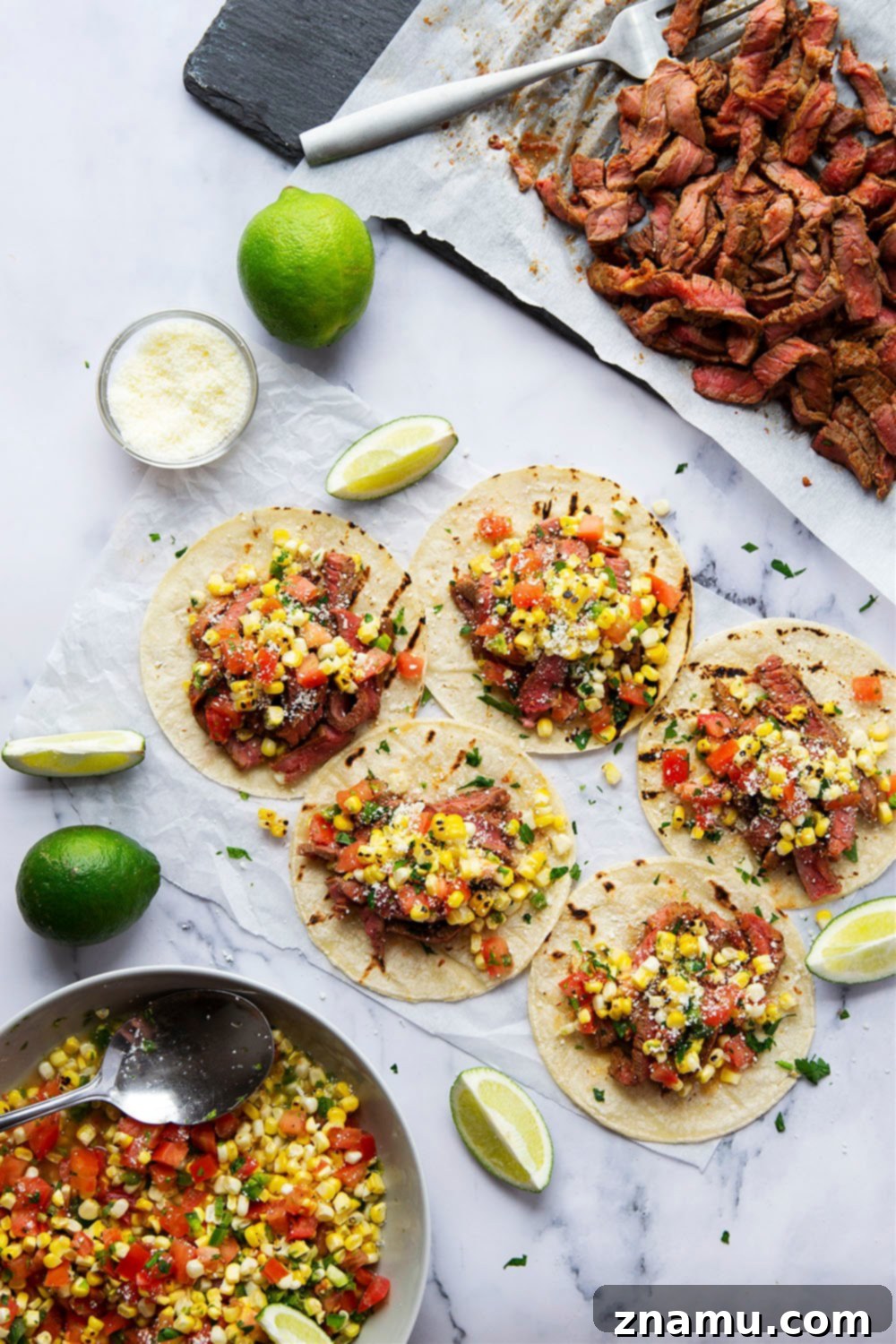 Smoky Chipotle Steak Tacos with Fire-Roasted Corn Salsa 3 Grilled chipotle steak tacos feature juicy grilled steak with a punch of smoky heat and piled high with a flavorful charred sweet corn salsa!