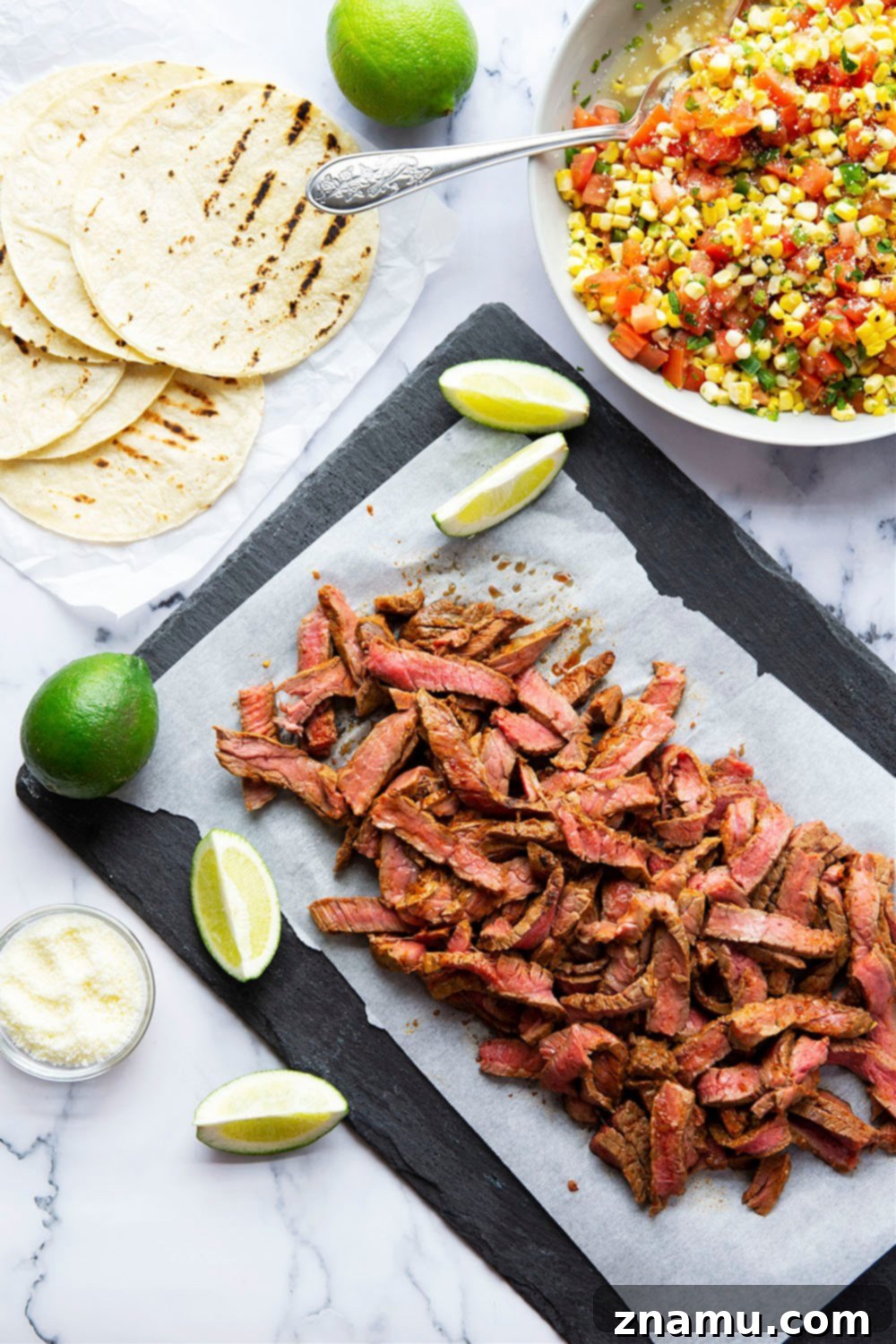 Smoky Chipotle Steak Tacos with Fire-Roasted Corn Salsa 5 Grilled chipotle steak tacos feature juicy grilled steak with a punch of smoky heat and piled high with a flavorful charred sweet corn salsa!