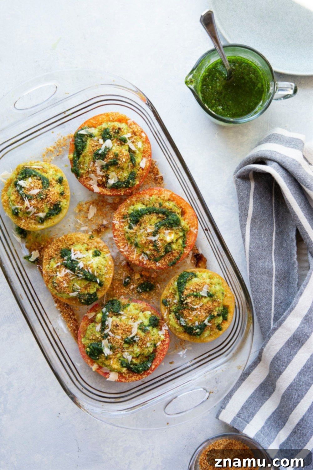 Pesto-Kissed Tomatoes with a Trio of Cheeses 2 Stuffed with three kinds of cheese and herby pesto, these pesto stuffed tomatoes are easy to whip up in minutes and the perfect use for an abundance of tomatoes!