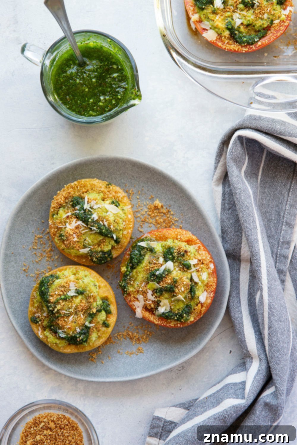 Pesto-Kissed Tomatoes with a Trio of Cheeses 3 Stuffed with three kinds of cheese and herby pesto, these pesto stuffed tomatoes are easy to whip up in minutes and the perfect use for an abundance of tomatoes!