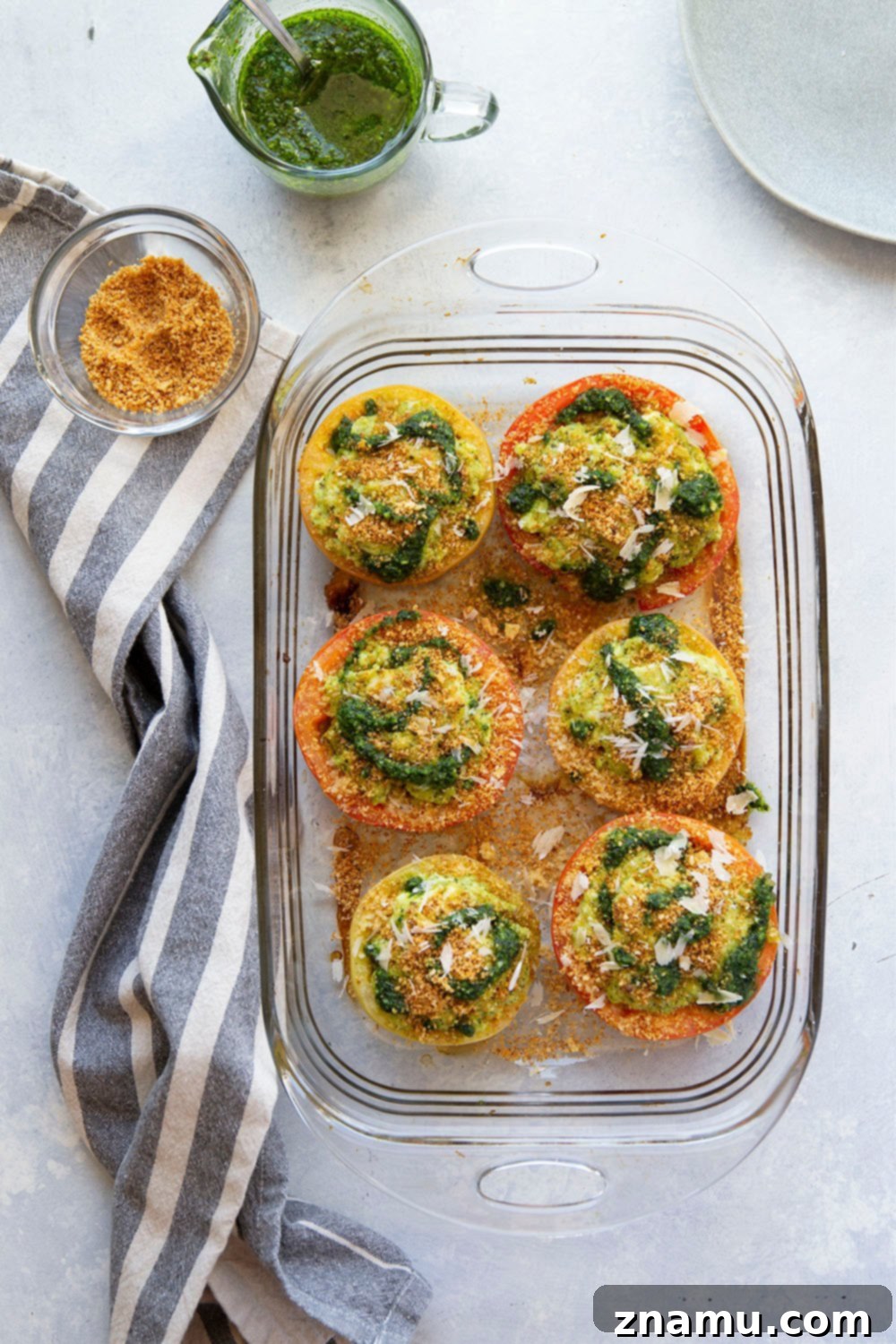 Pesto-Kissed Tomatoes with a Trio of Cheeses 4 Stuffed with three kinds of cheese and herby pesto, these pesto stuffed tomatoes are easy to whip up in minutes and the perfect use for an abundance of tomatoes!
