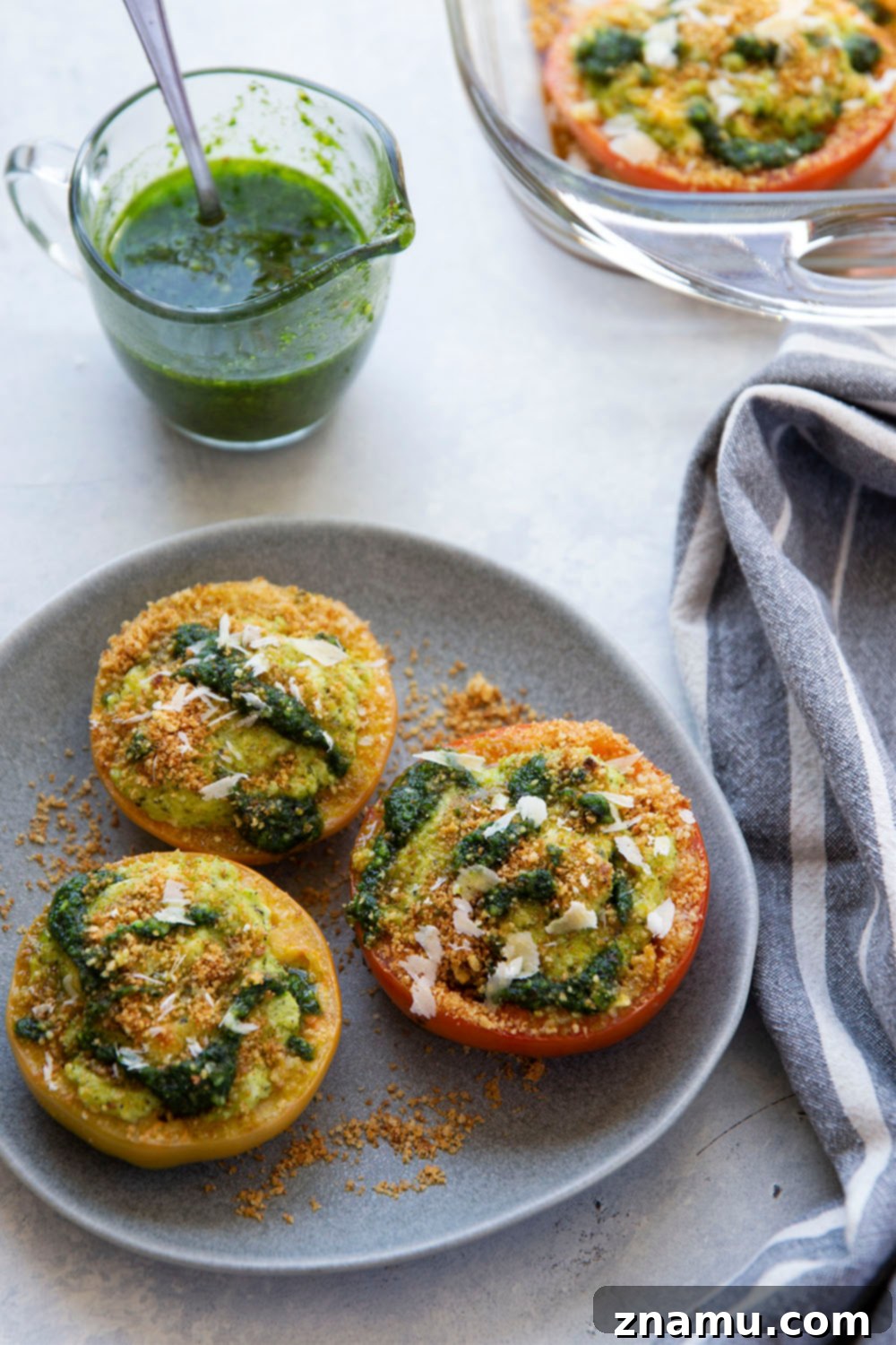 Pesto-Kissed Tomatoes with a Trio of Cheeses 5 Stuffed with three kinds of cheese and herby pesto, these pesto stuffed tomatoes are easy to whip up in minutes and the perfect use for an abundance of tomatoes!