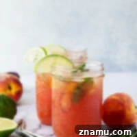 Rhubarb Peach Bourbon Smash is a refreshing summer cocktail with juicy peaches, fiery bourbon, and a tangy homemade rhubarb syrup.