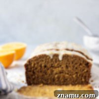This soft gingerbread loaf cake is packed with the perfect amount of ginger flavor and topped with a sweet orange glaze.