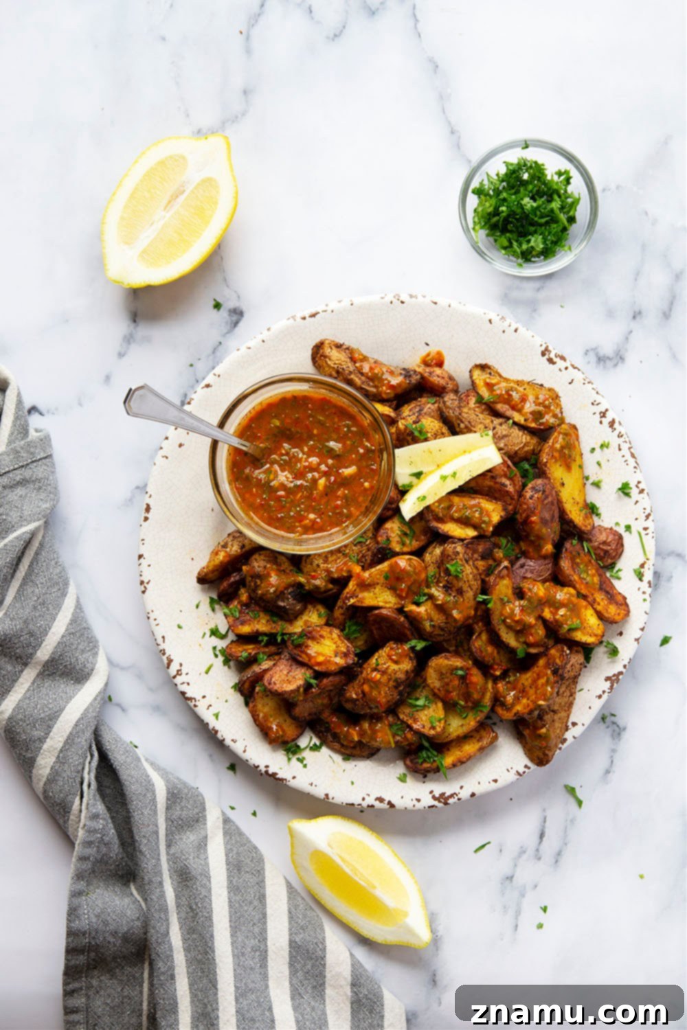 Crispy Air Fryer Fingerling Potatoes with Zesty Harissa Chimichurri 2 Crispy Air Fryer Fingerling Potatoes served with a flavorful Harissa Chimichurri sauce.