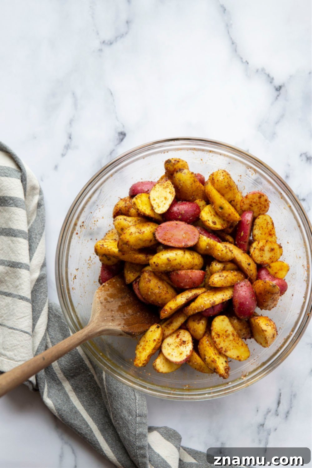 Crispy Air Fryer Fingerling Potatoes with Zesty Harissa Chimichurri 4 Close-up of crispy air fryer fingerling potatoes with fresh herbs.