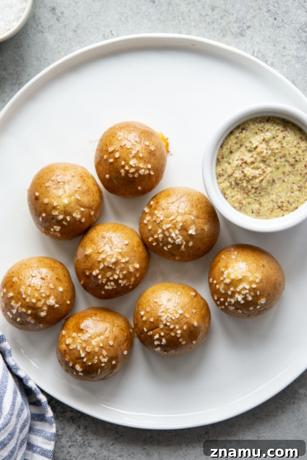 Cheese-Filled Pretzel Poppers 4 These cheese stuffed pretzel bites are ready in under an hour and feature a soft and chewy pretzel interior that's filled with gooey cheddar cheese!