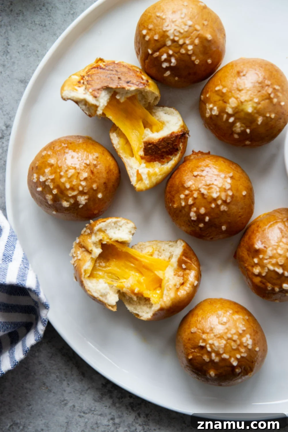 Cheese-Filled Pretzel Poppers 5 These cheese stuffed pretzel bites are ready in under an hour and feature a soft and chewy pretzel interior that's filled with gooey cheddar cheese!
