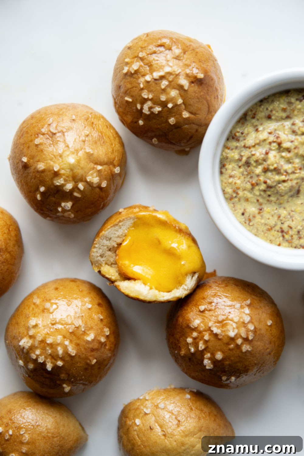 Cheese-Filled Pretzel Poppers 6 These cheese stuffed pretzel bites are ready in under an hour and feature a soft and chewy pretzel interior that's filled with gooey cheddar cheese!