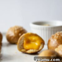 Cheese-Filled Pretzel Poppers 8 These cheese stuffed pretzel bites are ready in under an hour and feature a soft and chewy pretzel interior that's filled with gooey cheddar cheese!