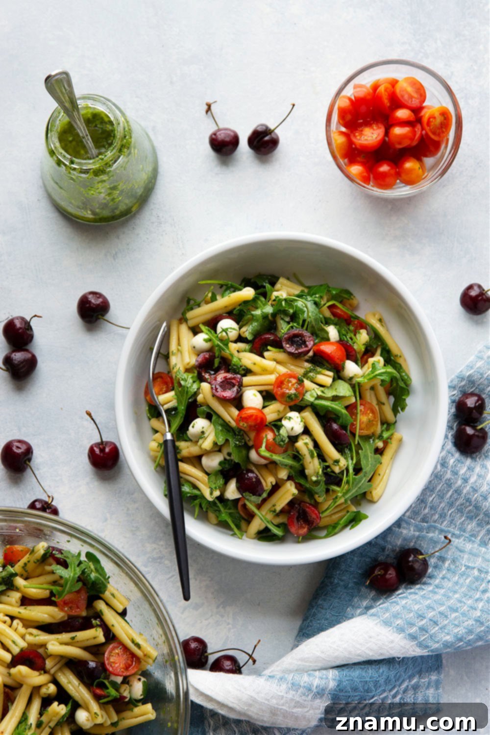 Caprese Pasta Delight: Cherry Tomatoes & Basil Vinaigrette 4 Ingredients for Cherry Caprese Pasta Salad: pasta, cherries, mozzarella, and basil.