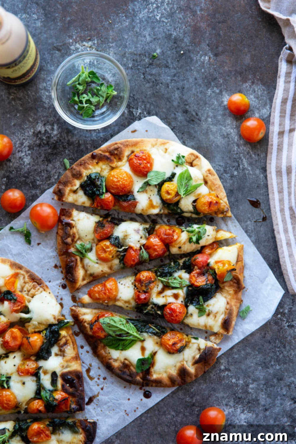 Creamy Burrata Flatbread with Burst Tomatoes and Spinach 2 Summery bursting tomato flatbread with juicy cherry tomatoes, tender baby spinach, and creamy burrata cheese, ready in under an hour.