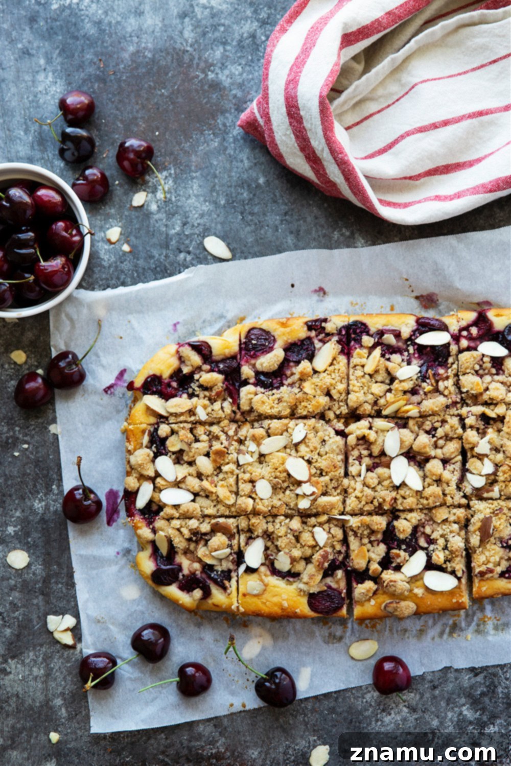 Sweet Cherry Almond Buckle 4 A close-up view of the irresistible buttery almond streusel topping on the Almond Cherry Buckle, glistening with baked cherries beneath.