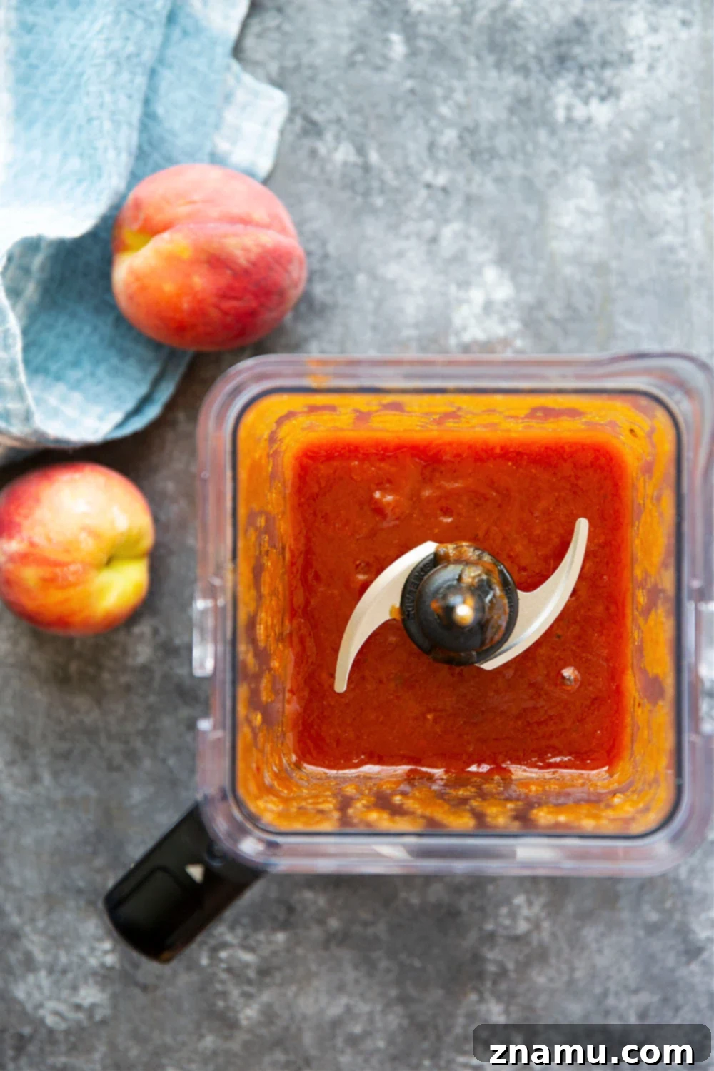Sweet Heat Peach Chipotle Glaze 3 Close-up of freshly made Chipotle Peach BBQ Sauce in a glass jar, highlighting its rich color and smooth texture.