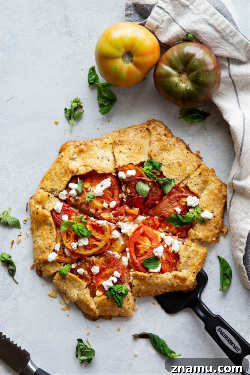 Creamy goat cheese and juicy heirloom tomatoes star in this savory tomato goat cheese galette that's a perfect lighter summer lunch or dinner!