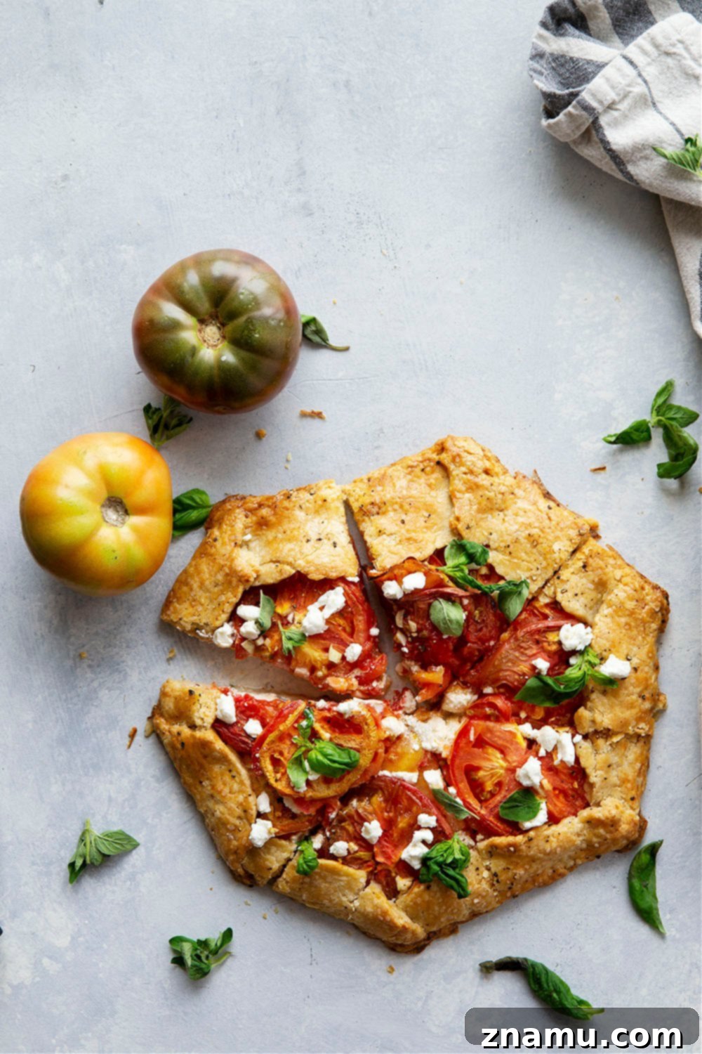 Creamy goat cheese and juicy heirloom tomatoes star in this savory tomato goat cheese galette that's a perfect lighter summer lunch or dinner!