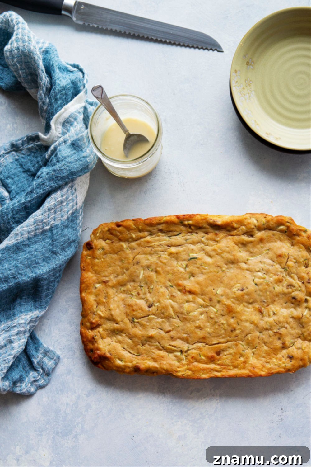 Nutty Brown Butter Banana Zucchini Loaf 3 Delicious Browned Butter Banana Zucchini Cake with a golden glaze, ready to be served.
