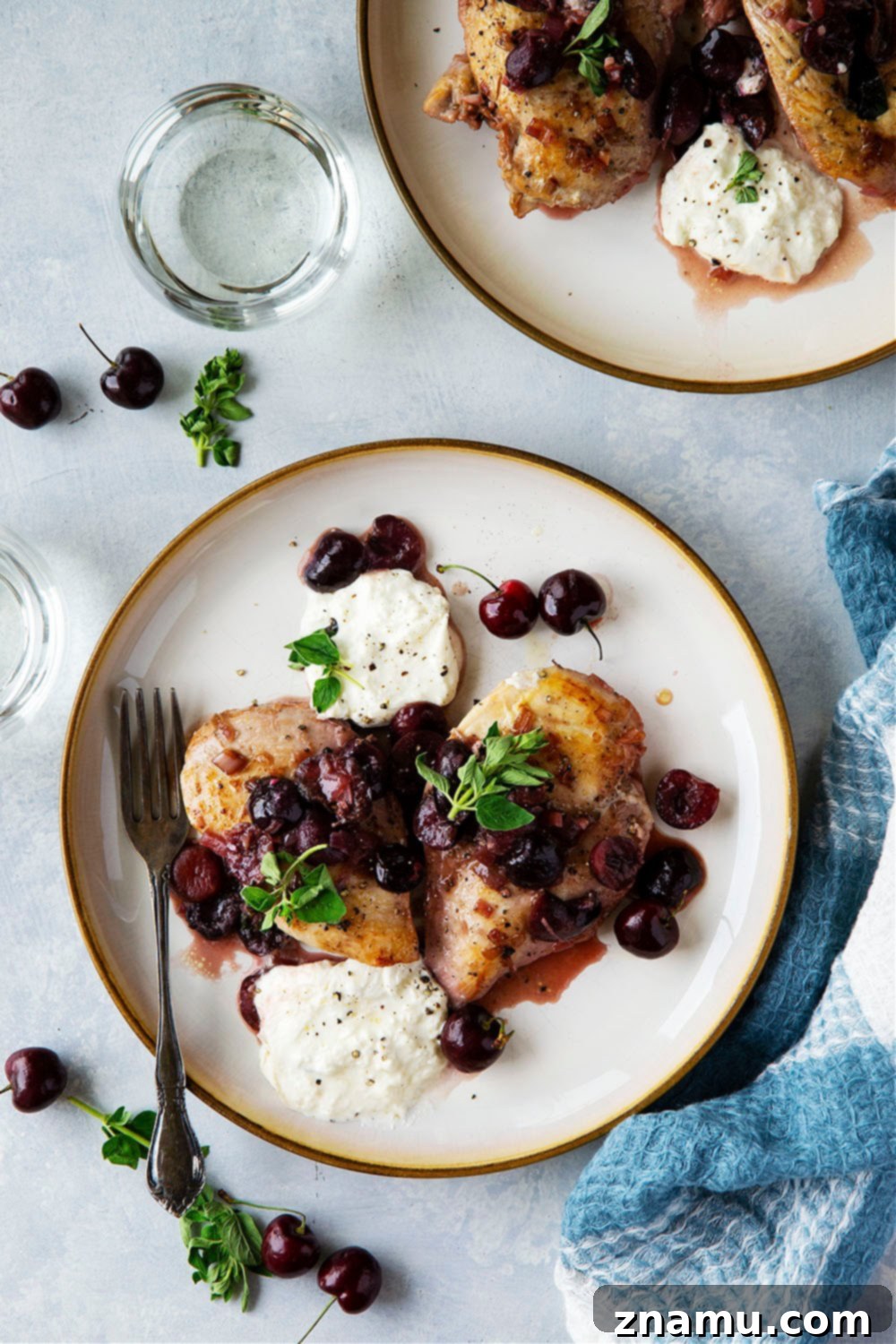 White Wine Cherry Chicken Skillet 5 Skillet Cherry Chicken with white wine sauce and fresh burrata, viewed from an overhead angle in a rustic setting.