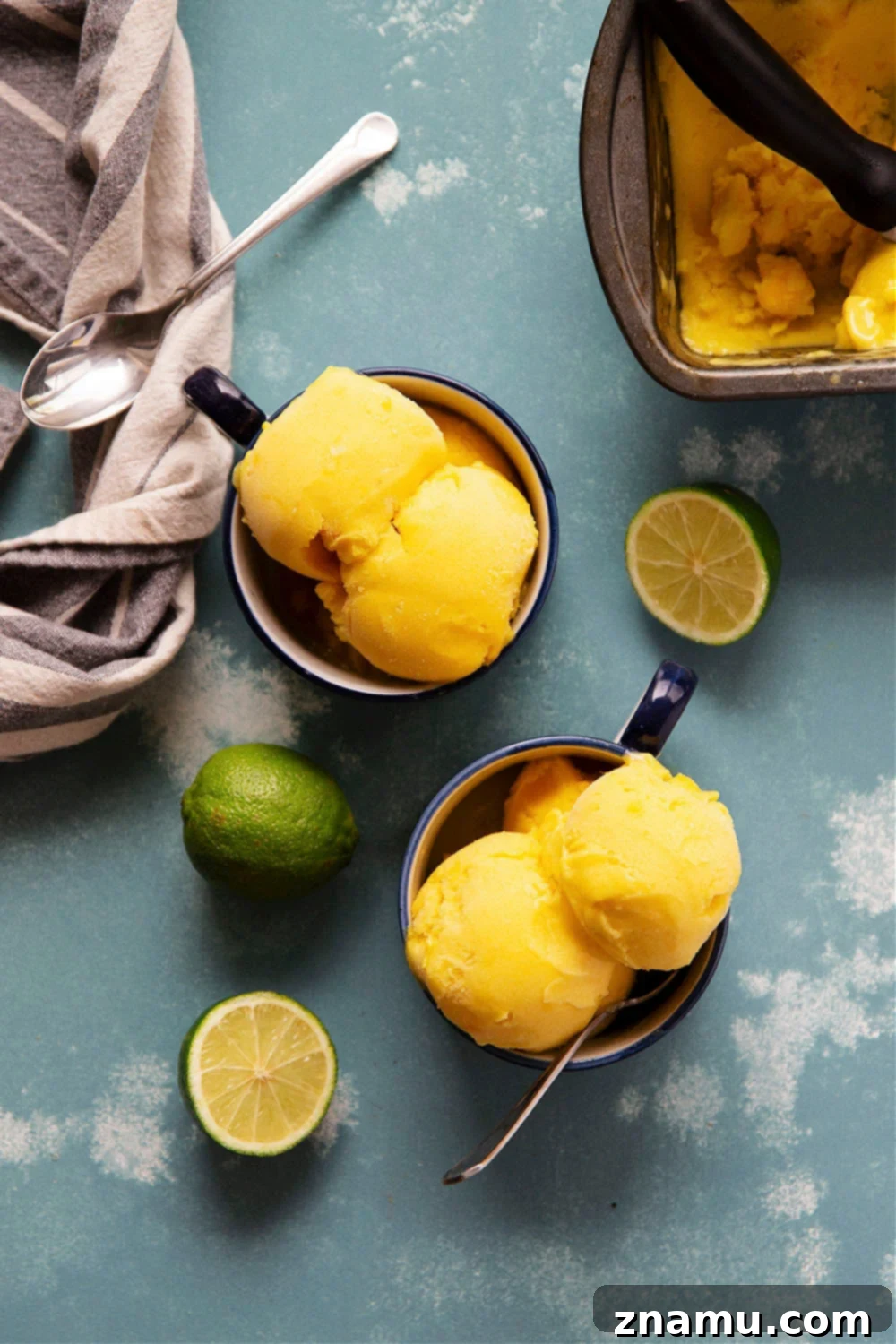 Tropical No Churn Mango Pineapple Sorbet 2 Vibrant and creamy mango pineapple sorbet in a bowl, a refreshing tropical dessert perfect for summer.