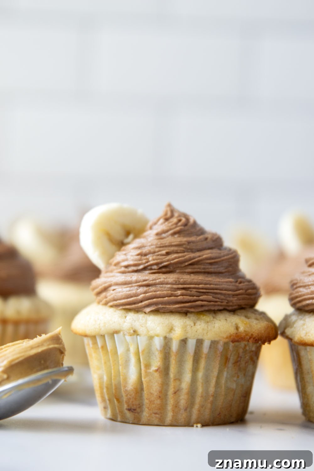 Rich Banana Cupcakes with Decadent Chocolate Peanut Butter Frosting 5 Ingredients laid out for banana cupcakes and chocolate peanut butter frosting