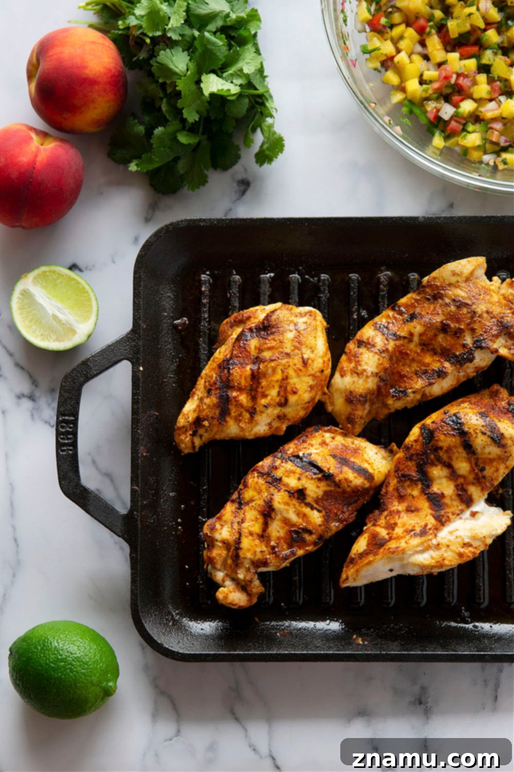 Smoky Blackened Chicken Tacos with Zesty Peach Salsa 5 Blackened chicken tacos feature a homemade blackened seasoning mix coating juicy chicken and a fresh spicy peach salsa on top.