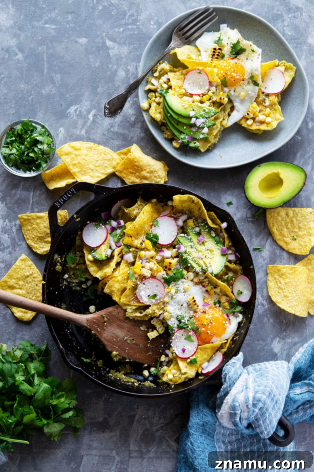 Ingredients laid out for making chilaquiles verdes, including fresh tomatillos, jalapenos, and corn chips.