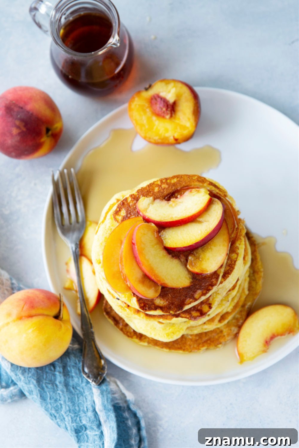 Golden Peach Cornmeal Pancakes 4 Juicy summer peaches and hearty cornmeal star in these tender, fluffy cornmeal peach pancakes that are a perfect stack for summer!