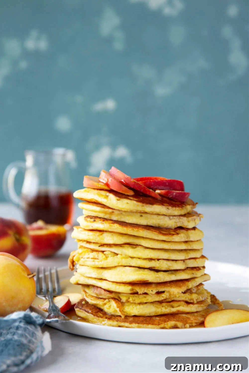 Golden Peach Cornmeal Pancakes 5 Juicy summer peaches and hearty cornmeal star in these tender, fluffy cornmeal peach pancakes that are a perfect stack for summer!