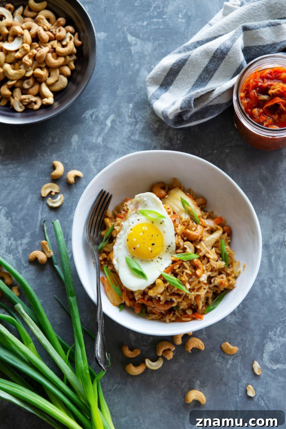 Spicy Kimchi Cashew Fried Rice 3 Flavorful kimchi and crunchy cashews take this kimchi cashew fried rice to the next level! Made easily in minutes with basic pantry ingredients and so much better than any takeout.