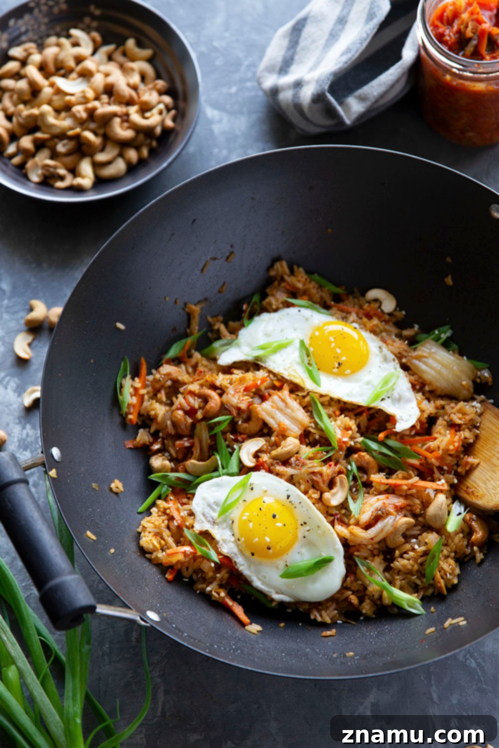 Spicy Kimchi Cashew Fried Rice 4 Flavorful kimchi and crunchy cashews take this kimchi cashew fried rice to the next level! Made easily in minutes with basic pantry ingredients and so much better than any takeout.