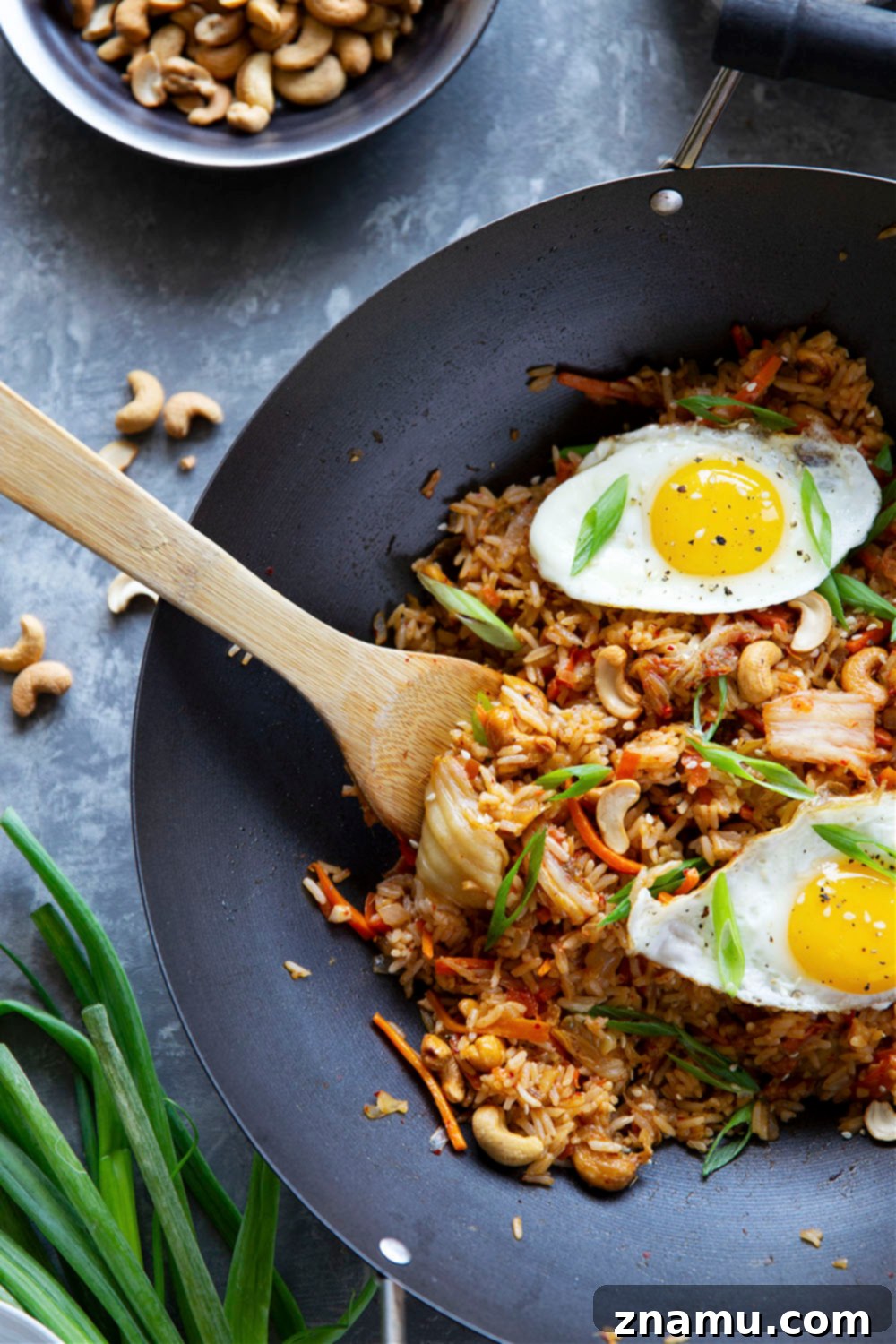 Spicy Kimchi Cashew Fried Rice 6 Flavorful kimchi and crunchy cashews take this kimchi cashew fried rice to the next level! Made easily in minutes with basic pantry ingredients and so much better than any takeout.