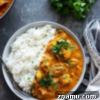 Mushroom Tikka Masala features tender yogurt-marinated mushrooms in a rich, spicy tikka masala sauce and served over fluffy rice with lots of cilantro on top.