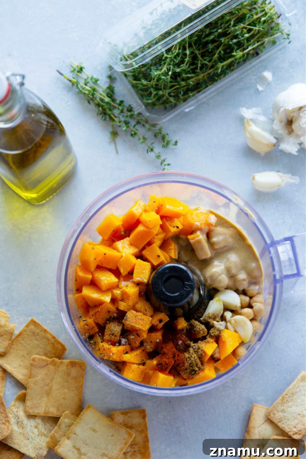 Velvety Roasted Garlic Butternut Squash Hummus 3 Flavorful roasted garlic and butternut squash gives this butternut squash hummus an unmatchable silky texture that you won't be able to keep those pita chips out of!
