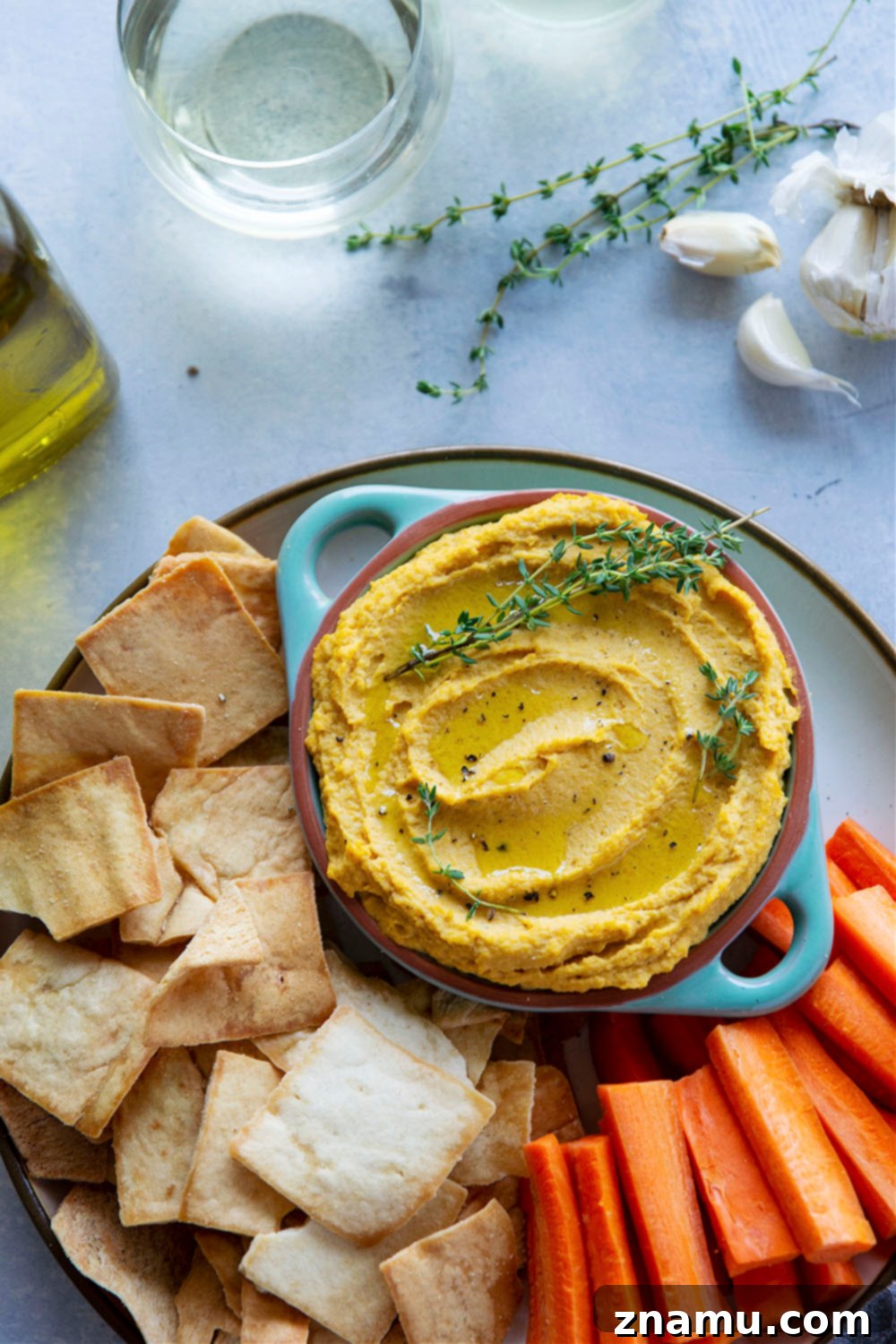 Velvety Roasted Garlic Butternut Squash Hummus 5 Flavorful roasted garlic and butternut squash gives this butternut squash hummus an unmatchable silky texture that you won't be able to keep those pita chips out of!