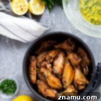 Made entirely in the air fryer and impossibly crispy, these lemon garlic chicken wings are a must-have addition to any appetizer table!