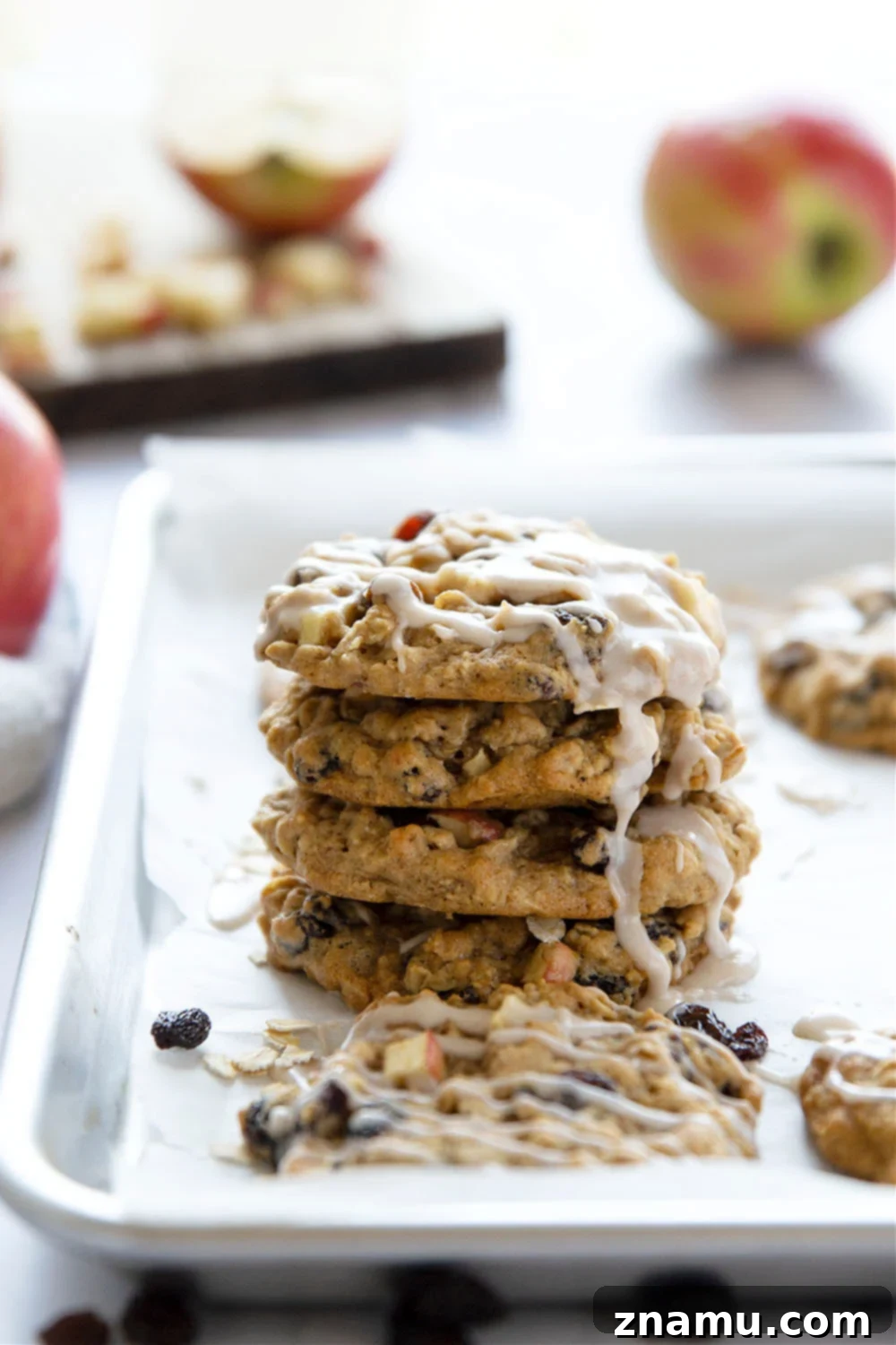 Sweetly Glazed Apple & Raisin Oatmeal Cookies 2 Delightful Oatmeal Raisin Apple Cookies with a creamy spiced glaze, perfect for fall baking.