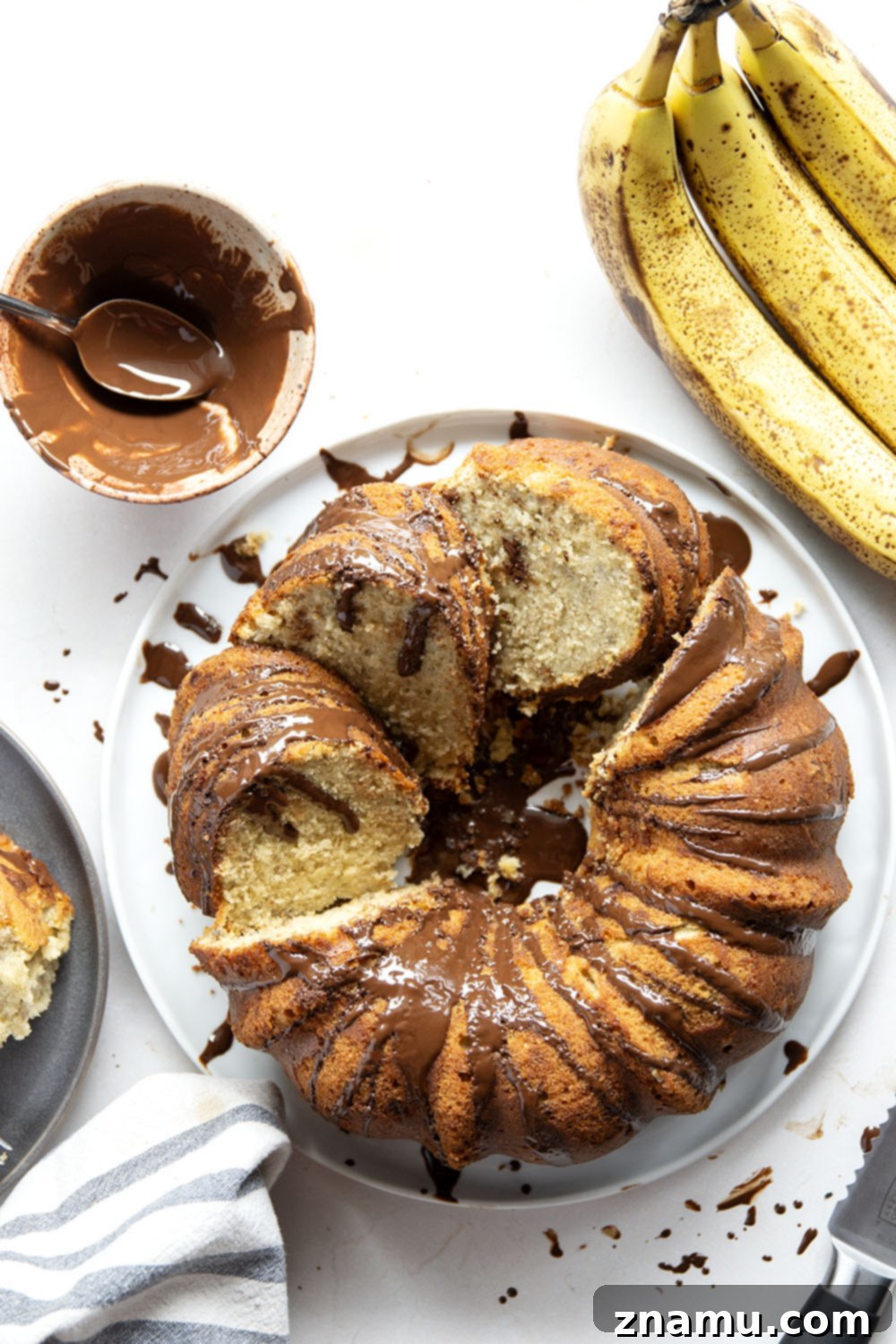 Decadent Chocolate Glazed Banana Pound Cake 3 Slice of moist banana pound cake with generous chocolate glaze