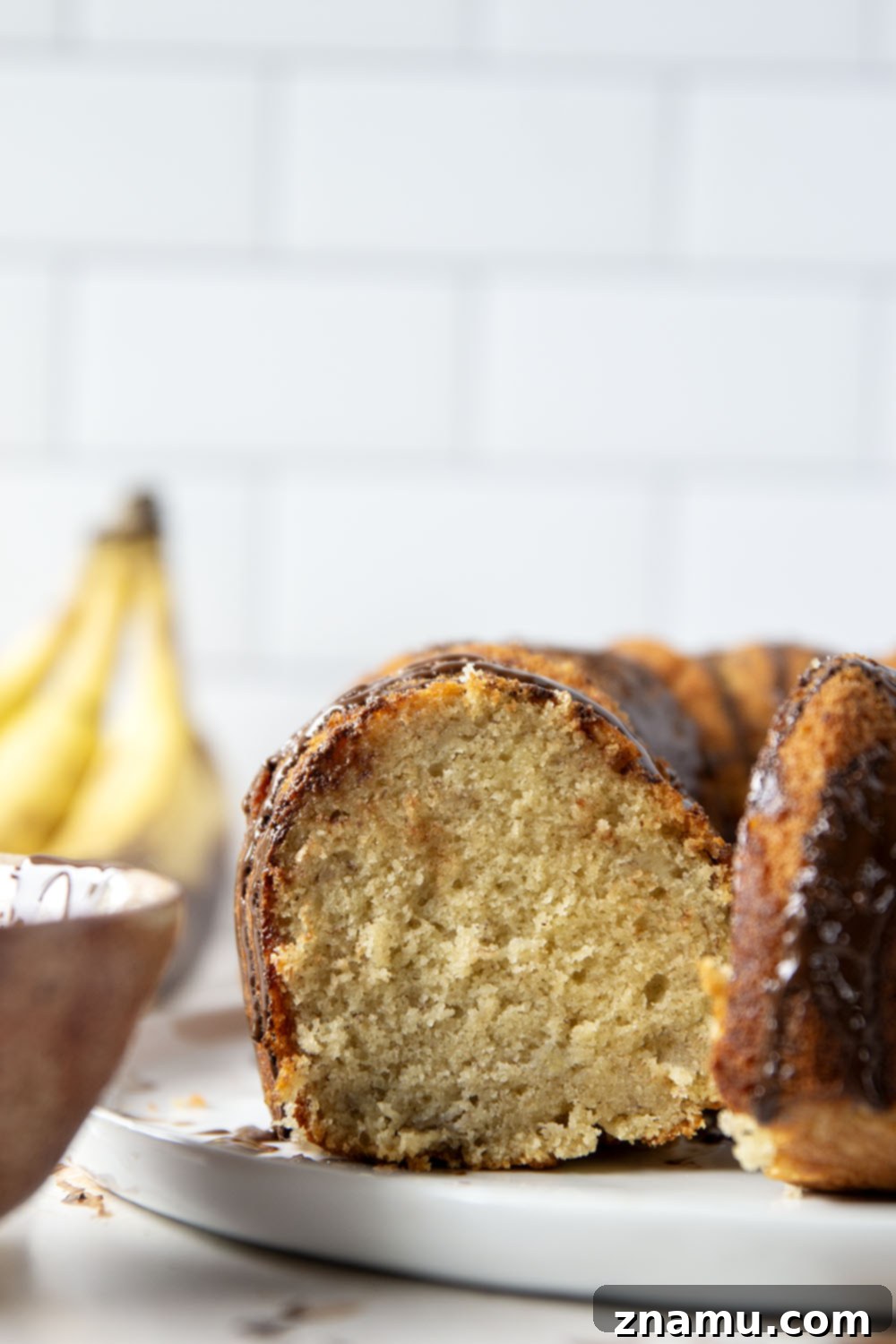 Decadent Chocolate Glazed Banana Pound Cake 5 Finished Chocolate Glazed Banana Pound Cake on a cooling rack