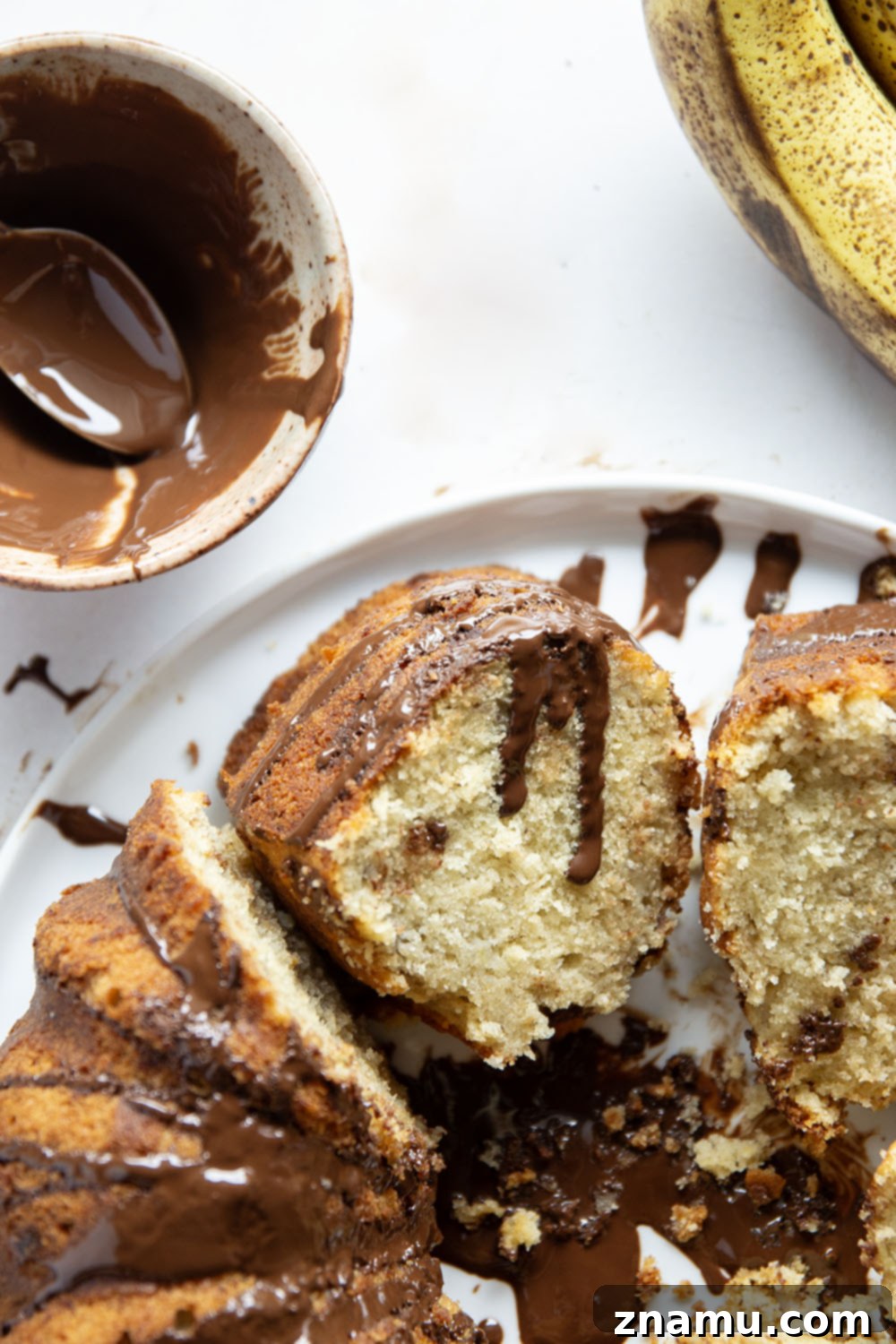 Decadent Chocolate Glazed Banana Pound Cake 6 Beautifully decorated Banana Pound Cake with chocolate glaze, ready to serve
