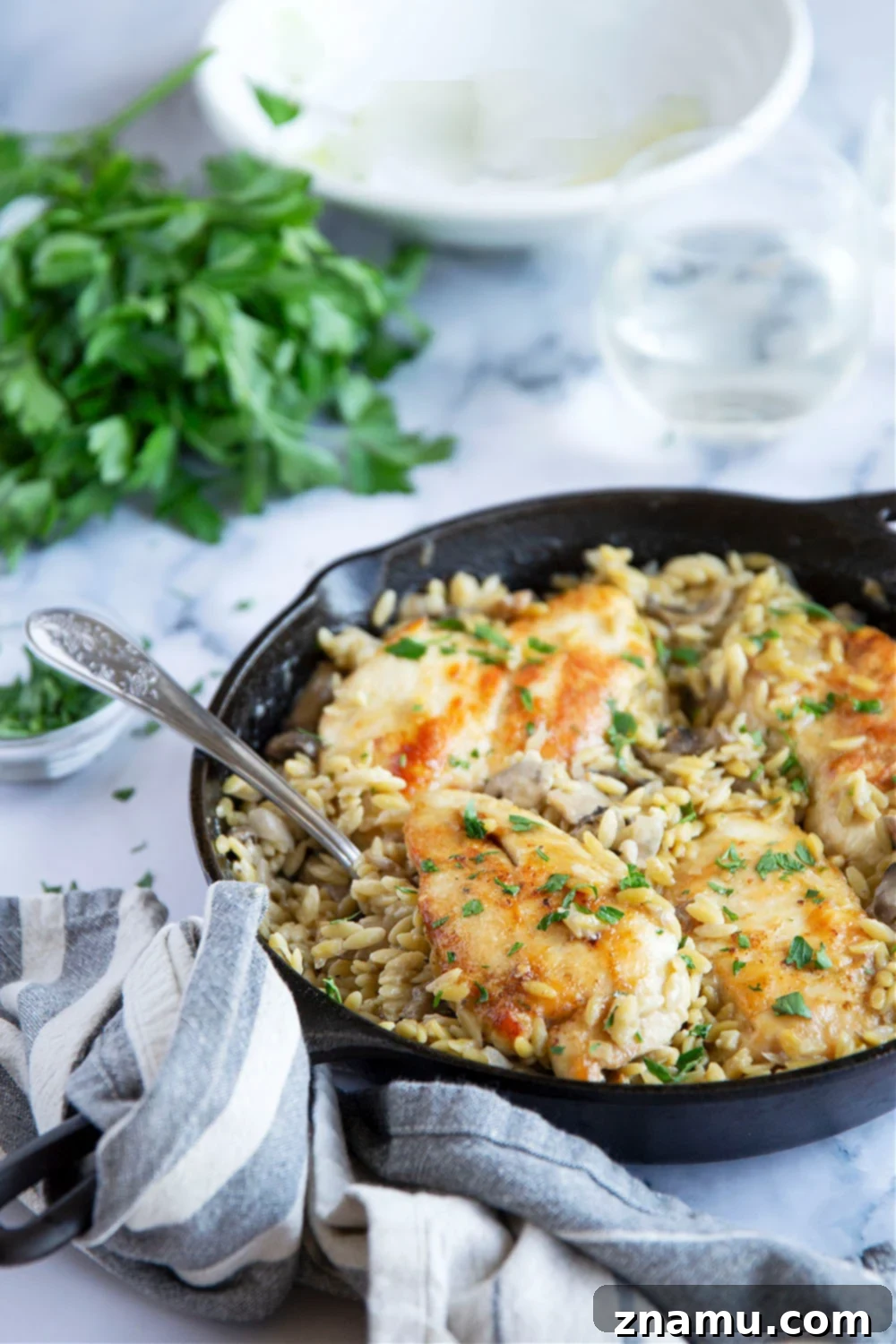 Creamy One-Pot Chicken Marsala Orzo 5 Prepping chicken breasts for One-Pot Chicken Marsala Orzo.