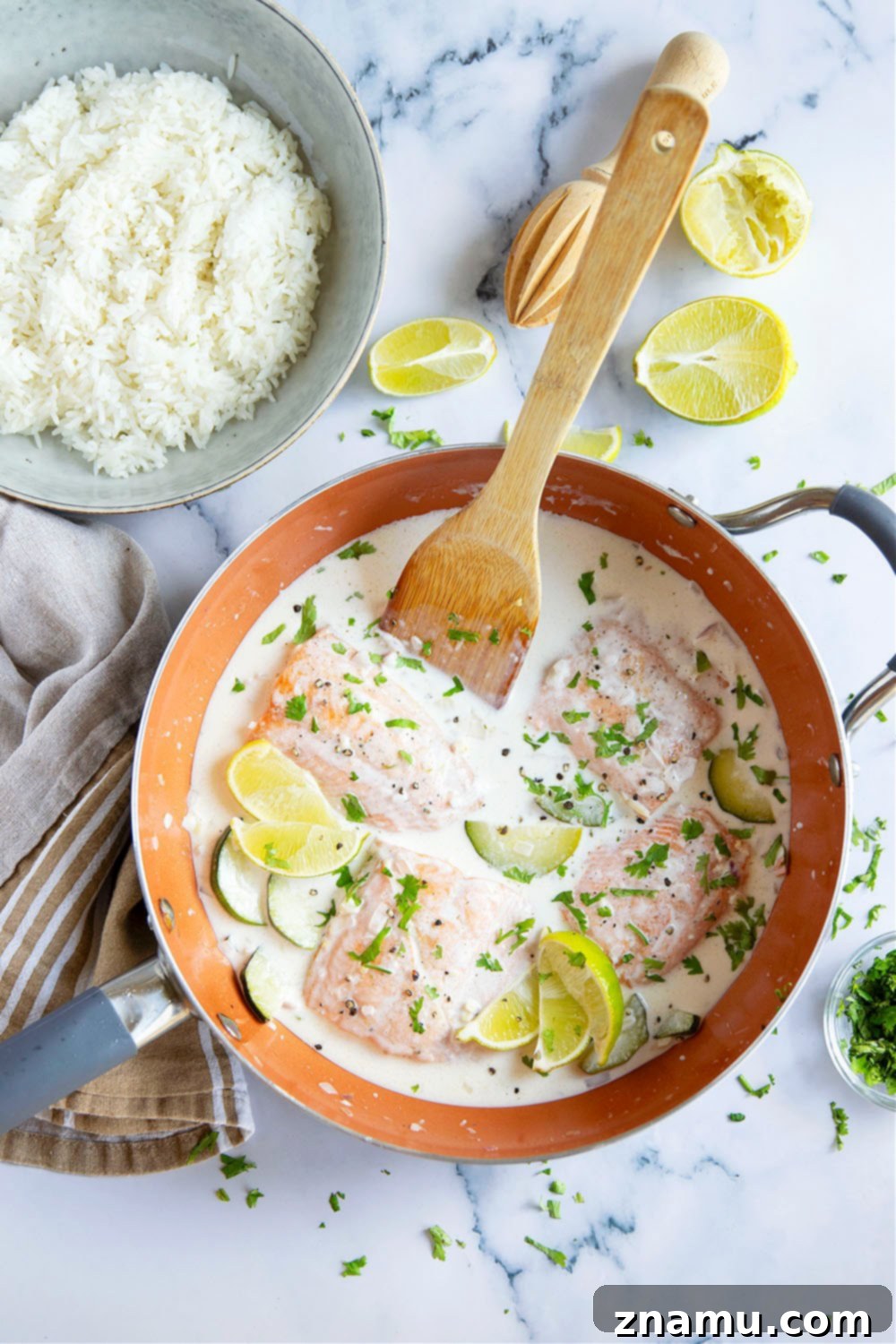 Creamy Coconut Salmon Skillet 2 Pan-seared salmon with rich coconut milk lime sauce, served over rice with cilantro. A delicious one-skillet meal.