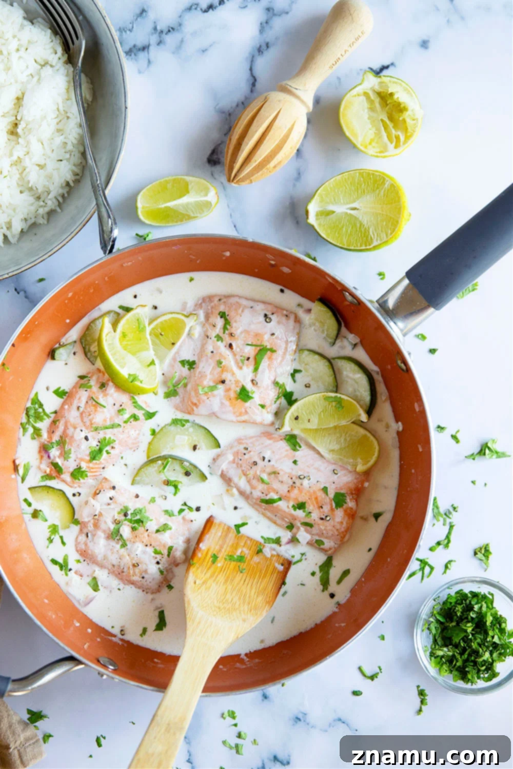 Creamy Coconut Salmon Skillet 5 Fresh, skinless salmon fillets seasoned with salt and pepper, ready for pan-searing.