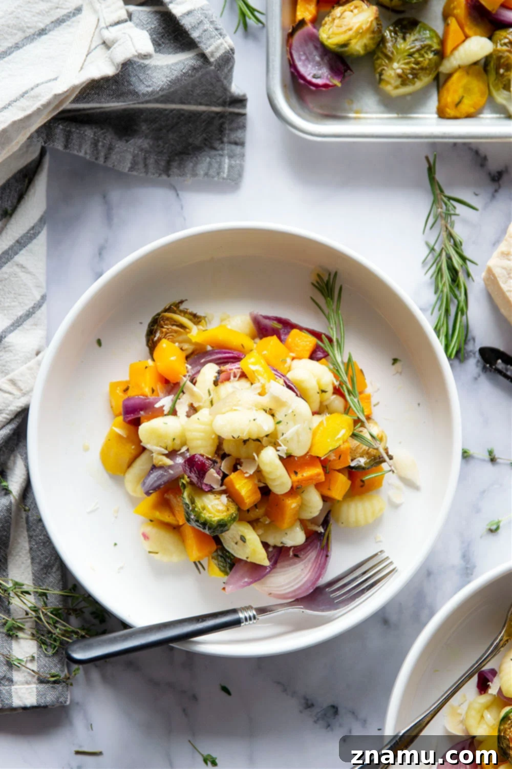 One-Pan Autumn Gnocchi & Roasted Vegetables 2 Sheet pan gnocchi is roasted with hearty fall vegetables entirely on one sheet pan in less than hour for an easy weeknight dinner with little to no cleanup!