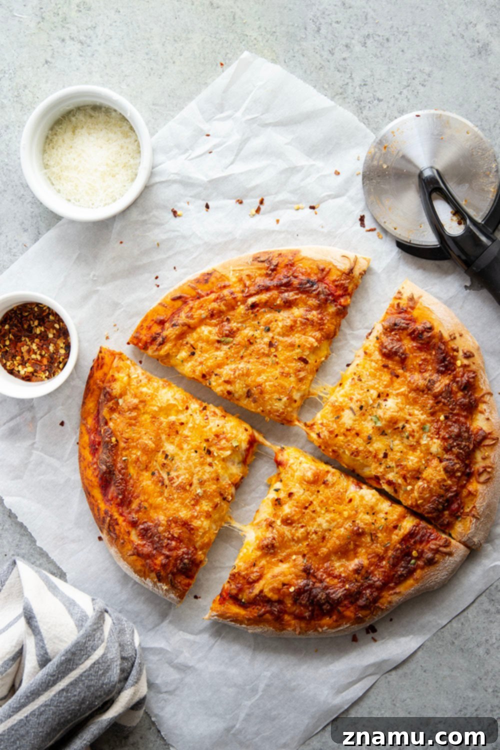 Triple Cheese Delight 4 A triple-cheese delight, this three cheese pizza features a perfectly soft and chewy homemade crust and lots of mozzarella, cheddar, and Parmesan.