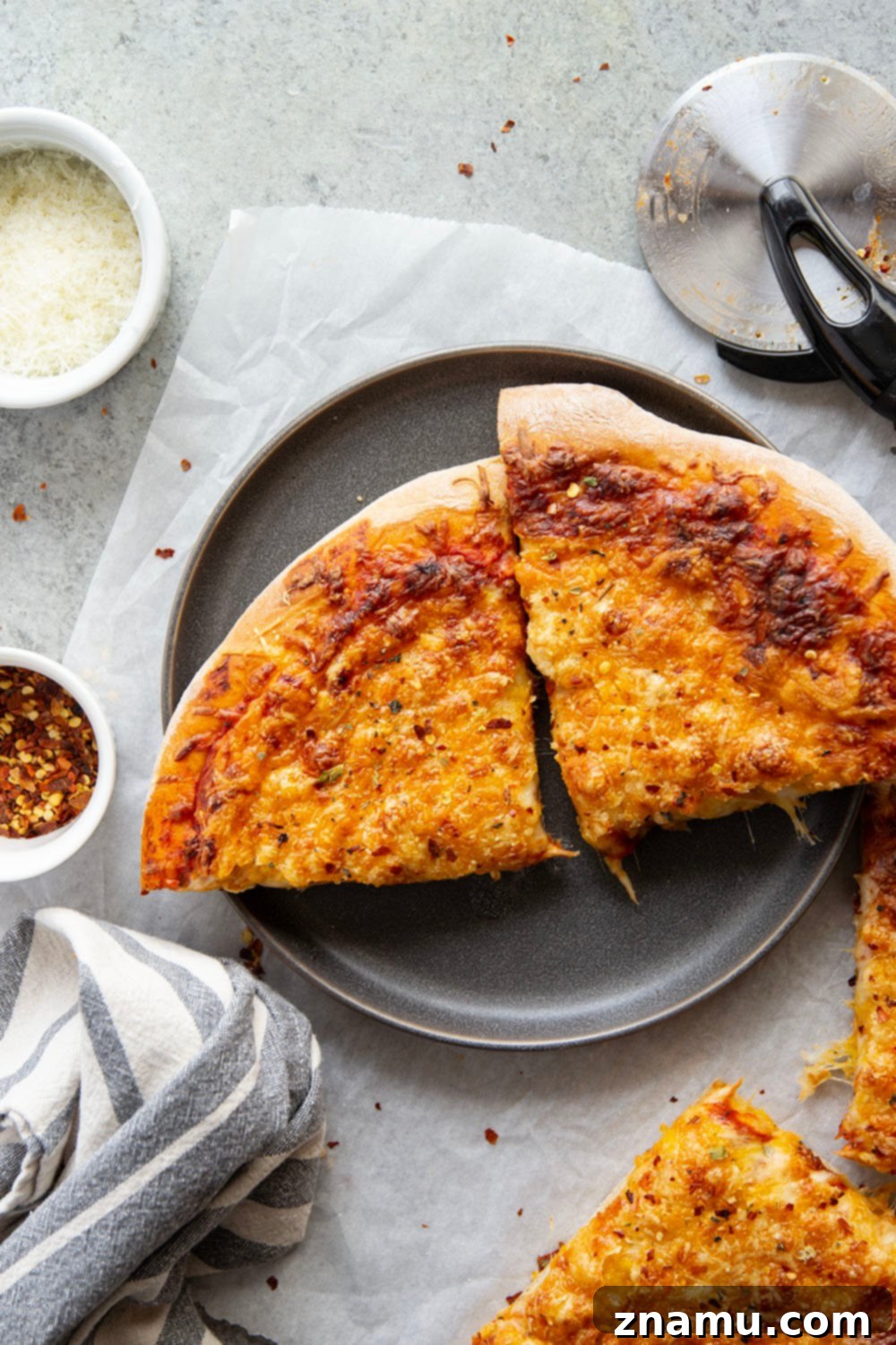 Triple Cheese Delight 5 A triple-cheese delight, this three cheese pizza features a perfectly soft and chewy homemade crust and lots of mozzarella, cheddar, and Parmesan.