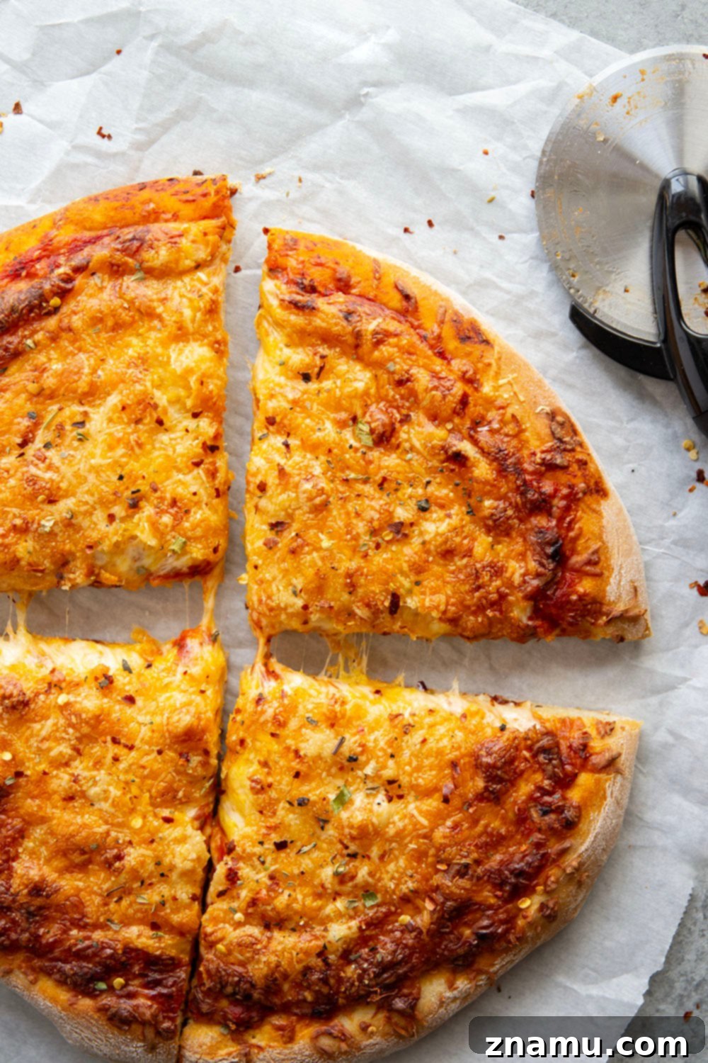Triple Cheese Delight 6 A triple-cheese delight, this three cheese pizza features a perfectly soft and chewy homemade crust and lots of mozzarella, cheddar, and Parmesan.