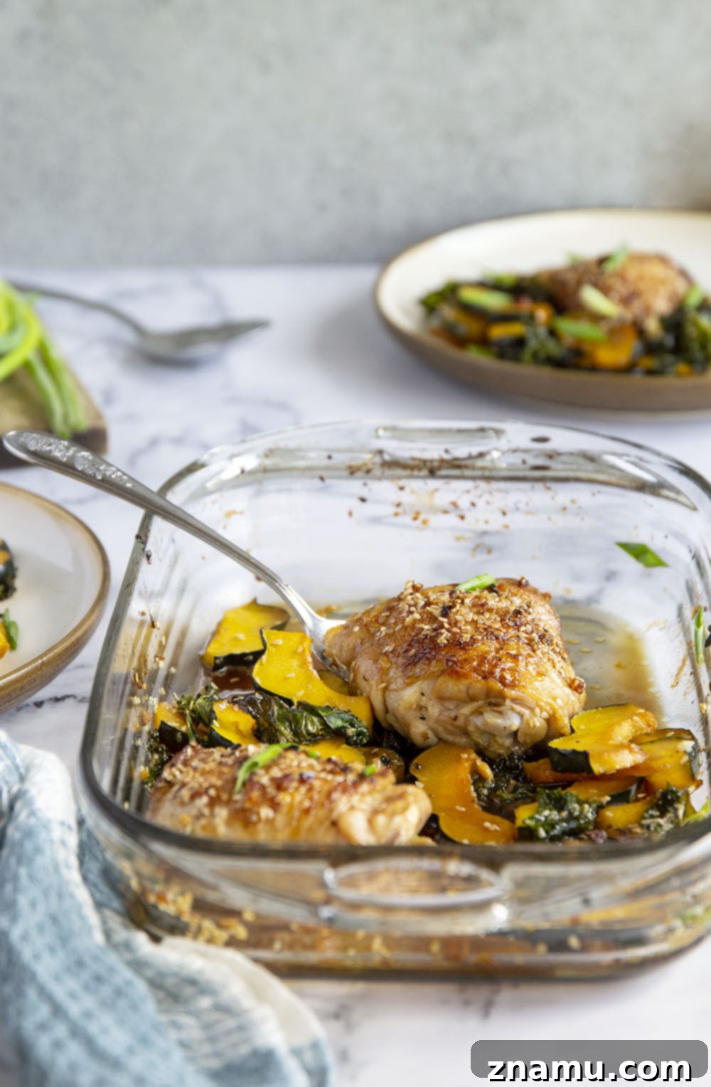 Honey Sesame Glazed Chicken Thighs with Roasted Acorn Squash and Sautéed Kale 3 Honey sesame chicken thighs are roasted with tender acorn squash and kale in a flavorful honey sesame sauce for an easy dinner made in less than an hour!