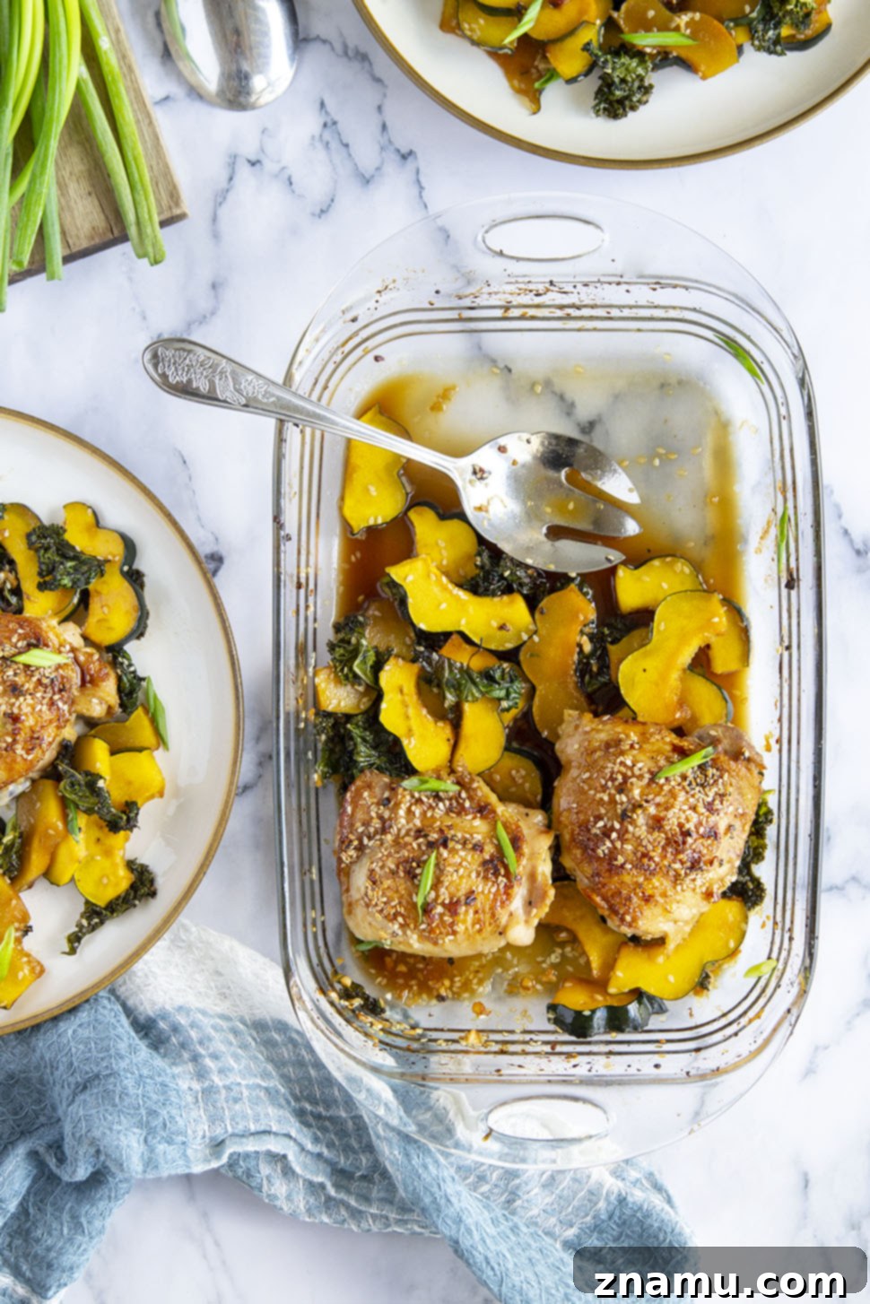 Honey Sesame Glazed Chicken Thighs with Roasted Acorn Squash and Sautéed Kale 5 Honey sesame chicken thighs are roasted with tender acorn squash and kale in a flavorful honey sesame sauce for an easy dinner made in less than an hour!
